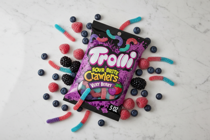 Trolli Sour Brite Crawlers Very Berry 5oz marble flat lay with fresh berries lifestyle
